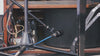 A microphone on a tripod pointed at a spinning tonewheel from a Hammond B3.